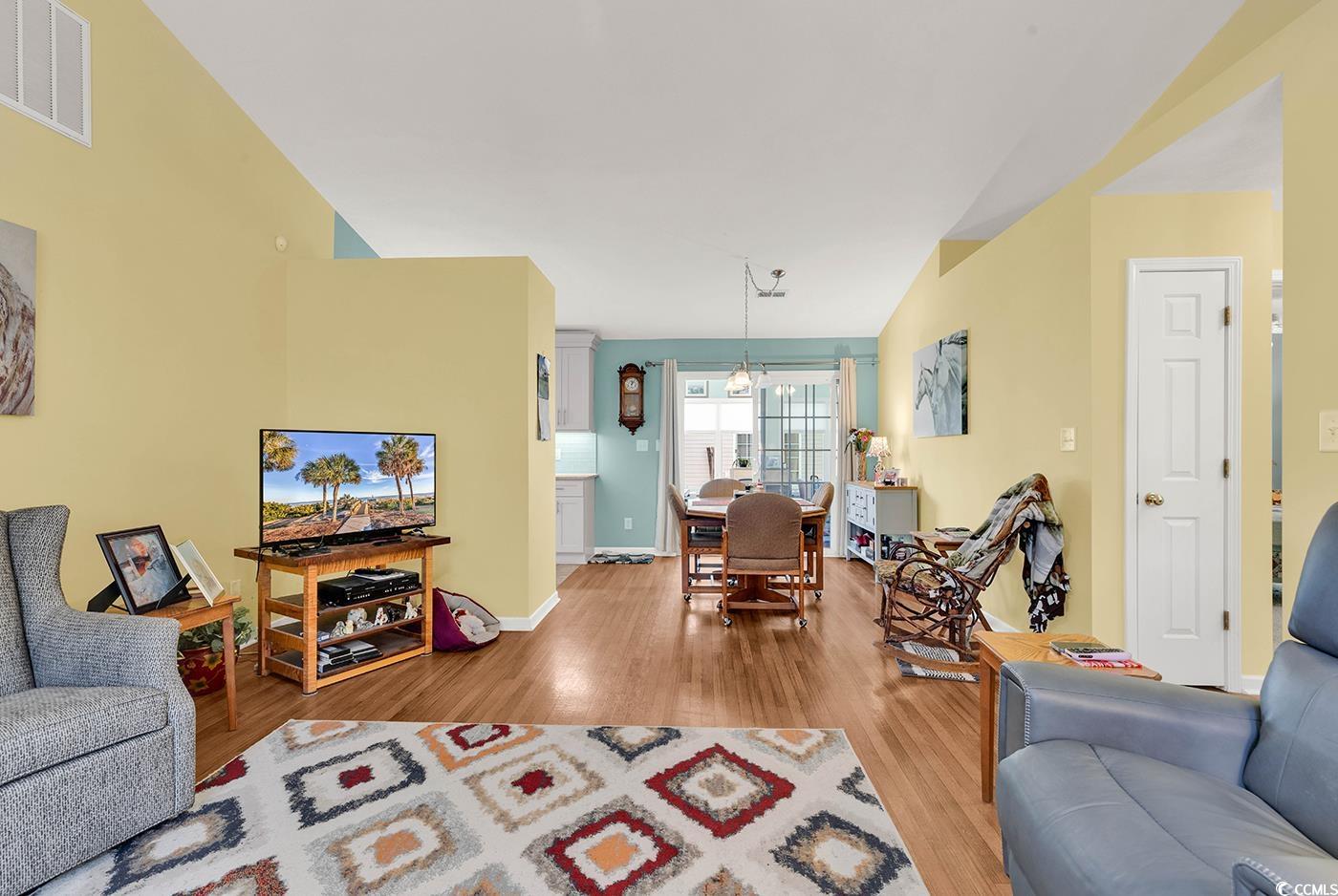 454 Sean River Road Conway, SC 29526 - Photo 13 of 38 Living area featuring wood finished floors and baseboards