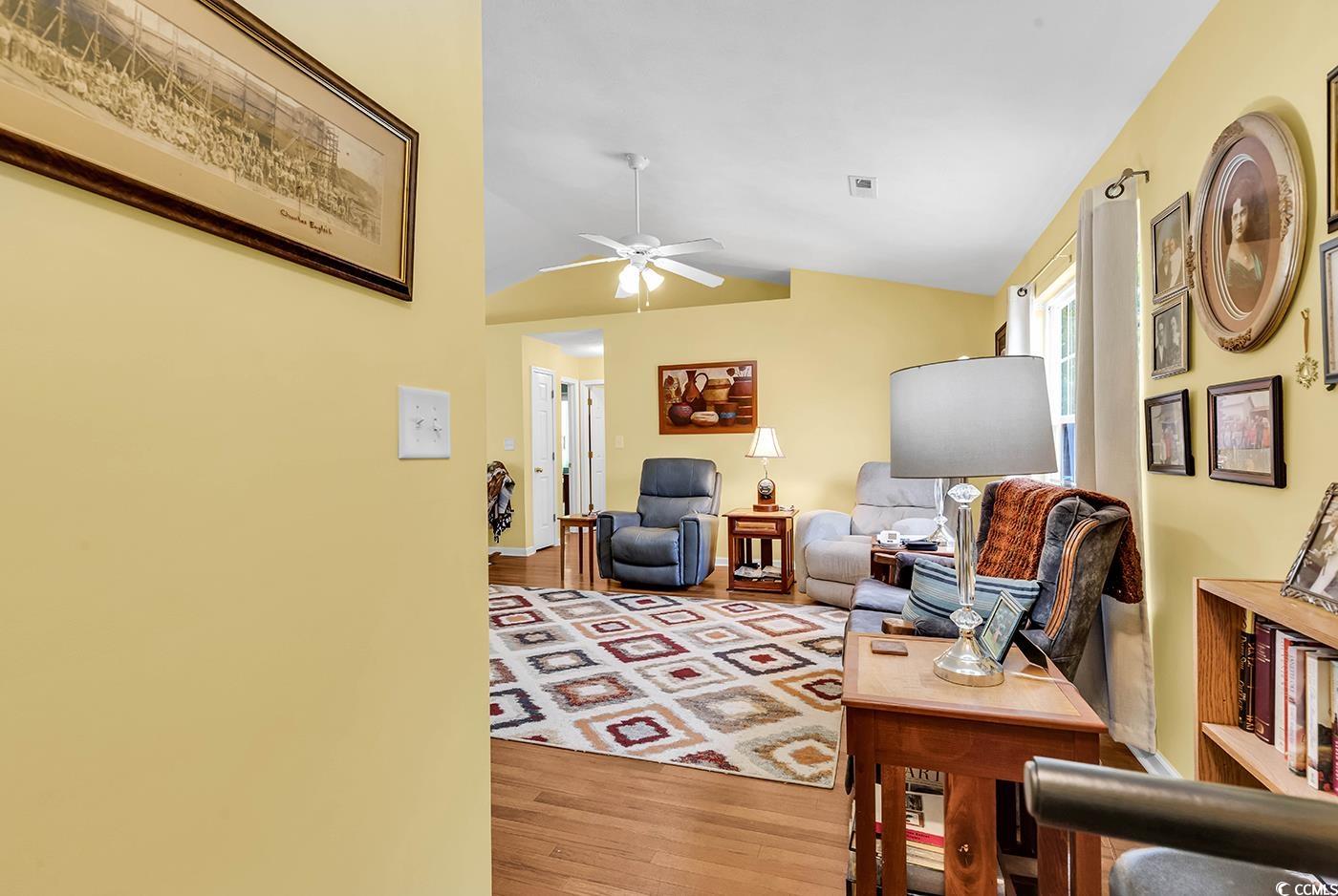 454 Sean River Road Conway, SC 29526 - Photo 14 of 38 Living area featuring light wood-style floors, lofted ceiling, and ceiling fan