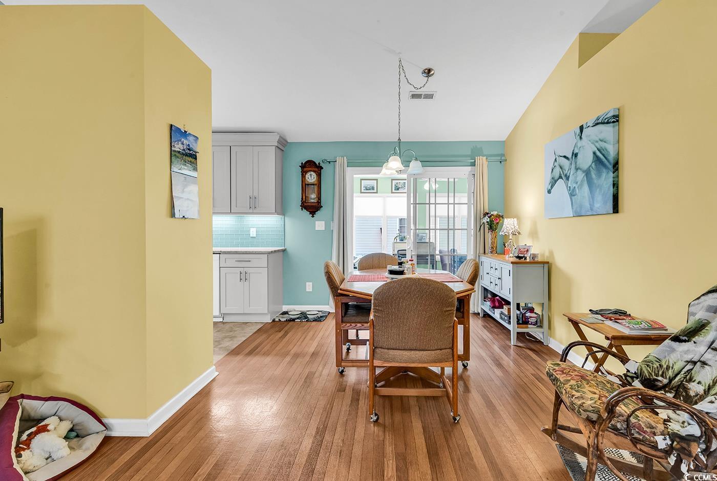 454 Sean River Road Conway, SC 29526 - Photo 7 of 38 Dining room featuring light wood-type flooring and baseboards