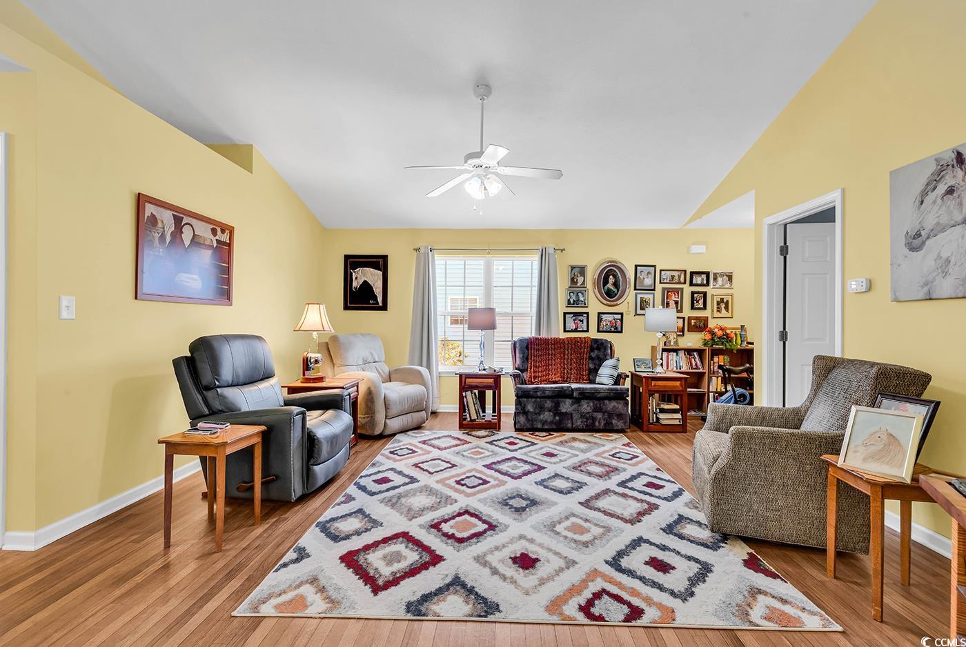 454 Sean River Road Conway, SC 29526 - Photo 10 of 38 Living room featuring vaulted ceiling, ceiling fan, light wood-type flooring, and baseboards