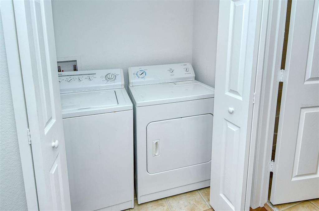 1064 North Tamiami Trail, Unit 1627 Sarasota, FL 34236 - Photo 29 of 97 a utility room with dryer and washer