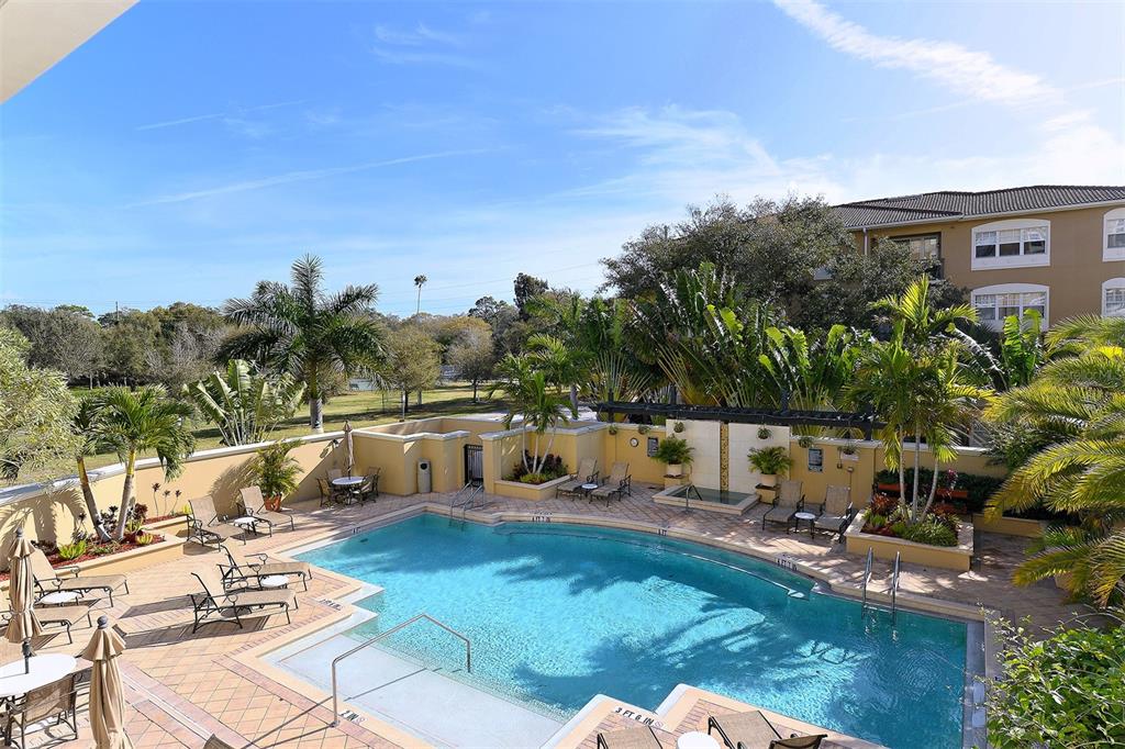 1064 North Tamiami Trail, Unit 1627 Sarasota, FL 34236 - Photo 38 of 97 a view of a swimming pool with a patio