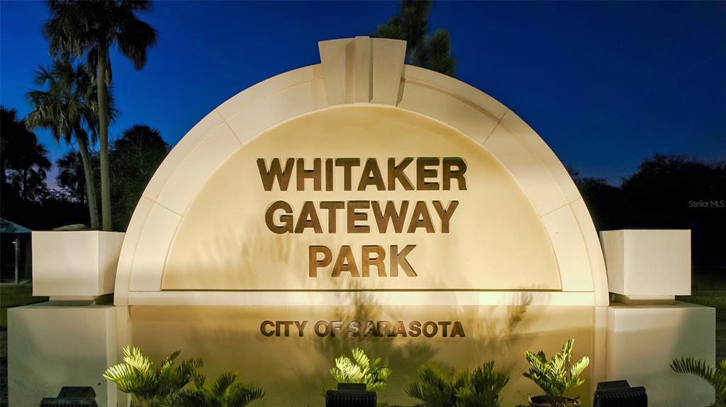 1064 North Tamiami Trail, Unit 1627 Sarasota, FL 34236 - Photo 55 of 97 a close up of a sign with a potted plant on it