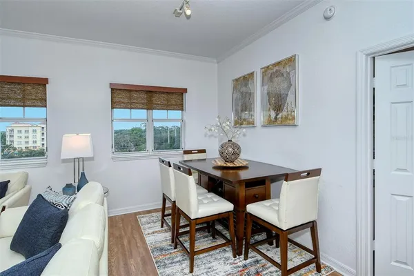 a kitchen with table and chairs