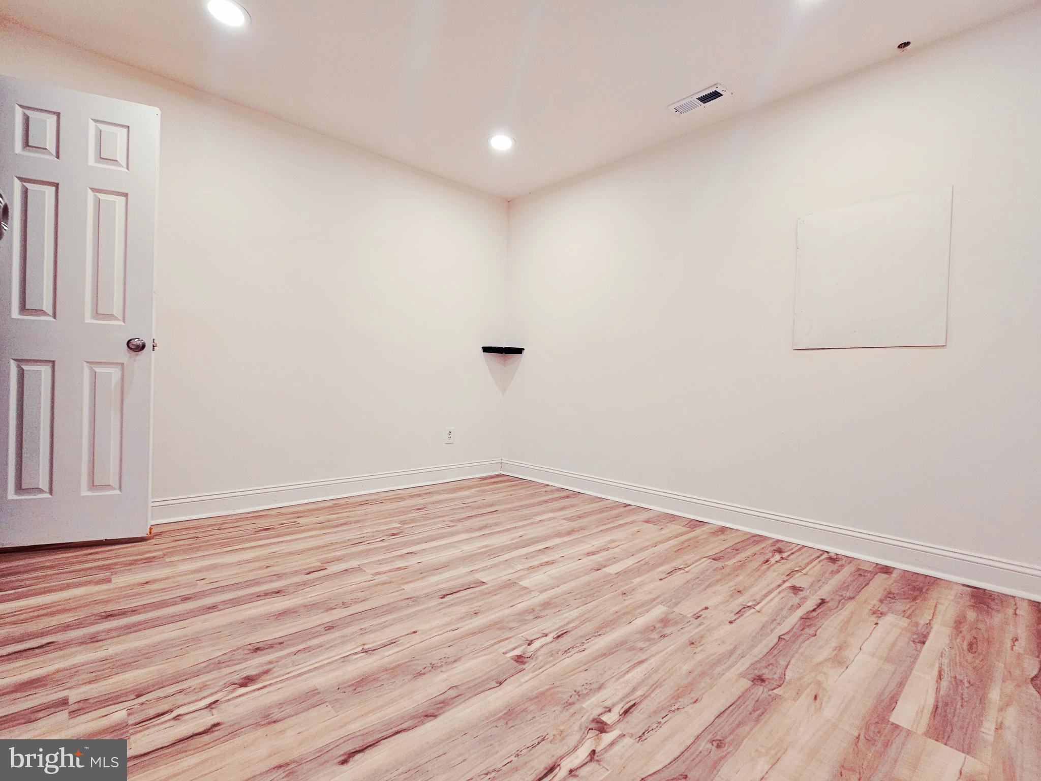 605 Villager Circle Baltimore, MD 21222 - Photo 23 of 41 a view of empty room with wooden floor
