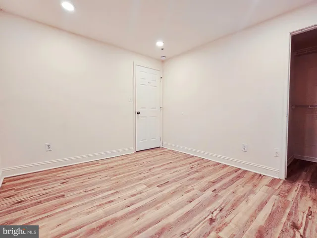 a view of room with wooden floor