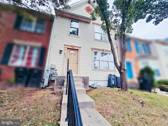 a view of a house with a snow on the road