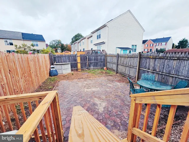 a view of a balcony with furniture