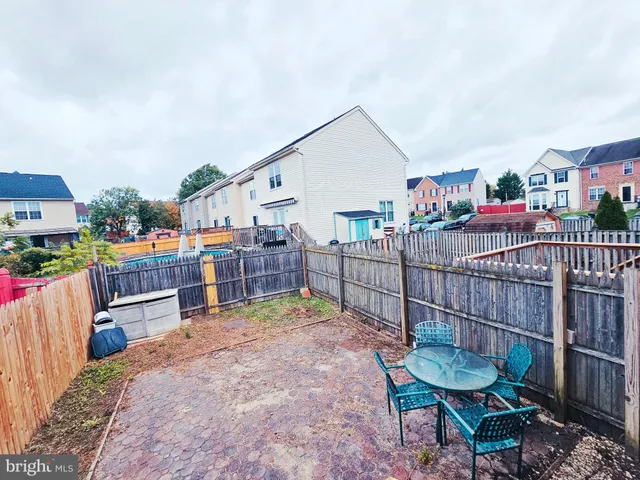 a view of a house with outdoor seating and a patio