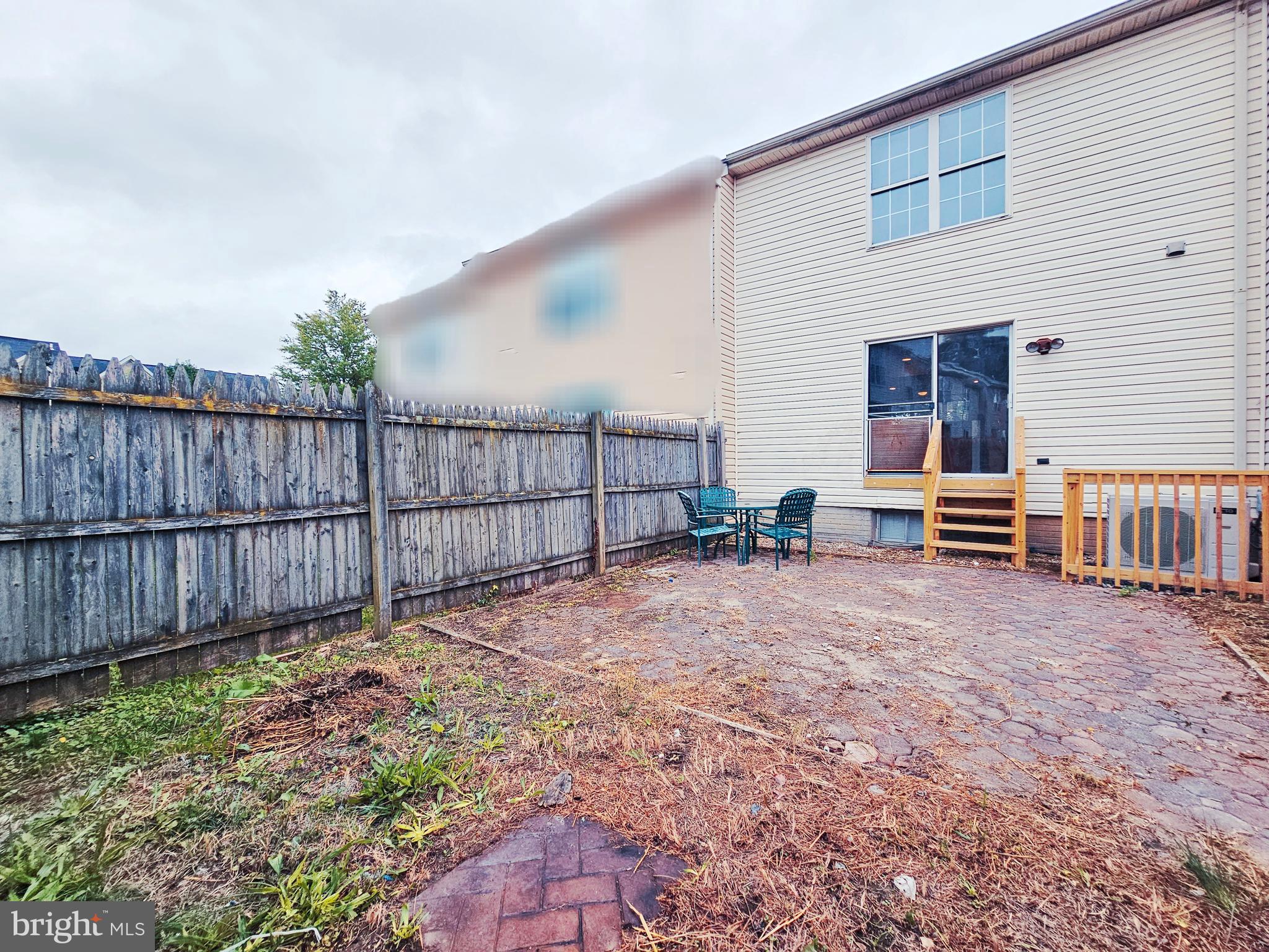 605 Villager Circle Baltimore, MD 21222 - Photo 40 of 41 a view of a backyard with wooden fence