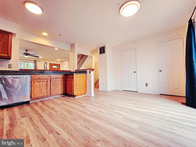 a view of kitchen with cabinets