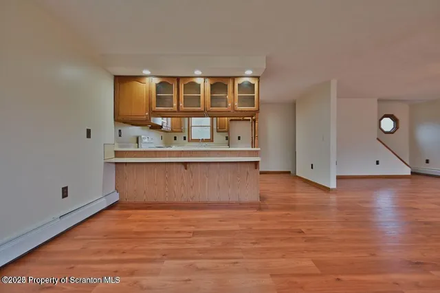 a view of kitchen with wooden floor
