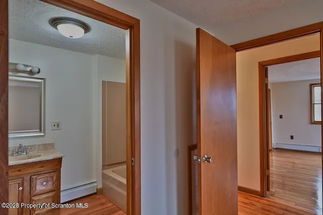 a bathroom with a toilet a sink and bathtub