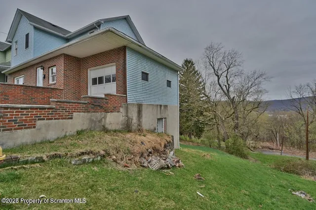 a view of a backyard of the house