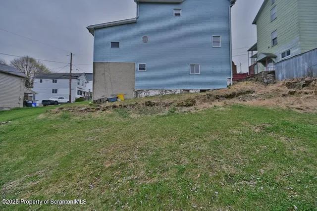 a view of a room with wooden walls