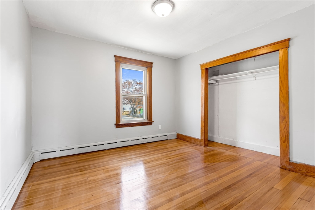 105 Conant Street Gardner, MA 01440 - Photo 11 of 19 an empty room with wooden floor and windows
