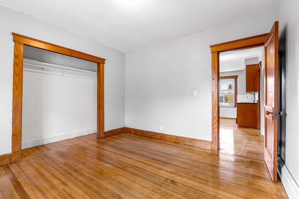 105 Conant Street Gardner, MA 01440 - Photo 12 of 19 a view of an empty room with wooden floor