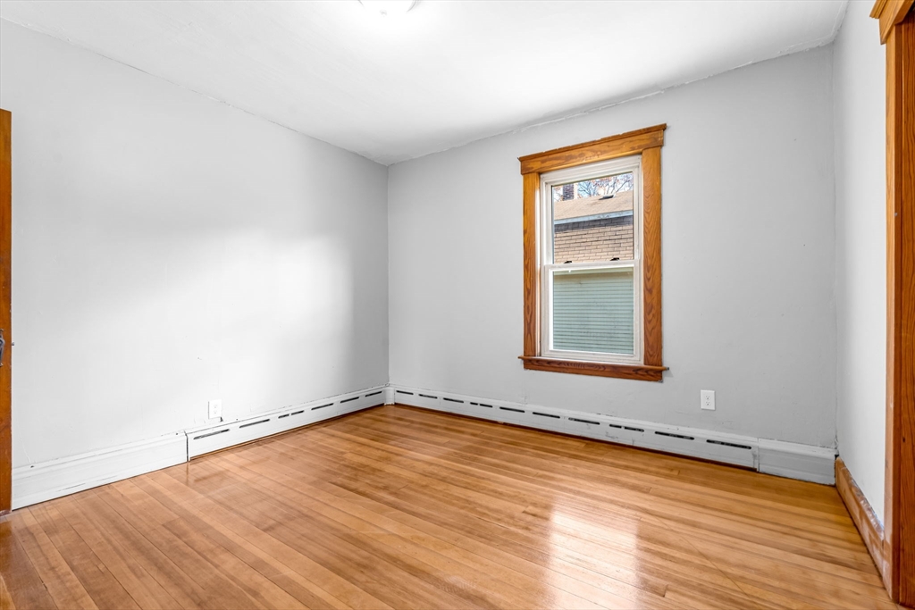 105 Conant Street Gardner, MA 01440 - Photo 14 of 19 a view of a room with wooden floor and a window