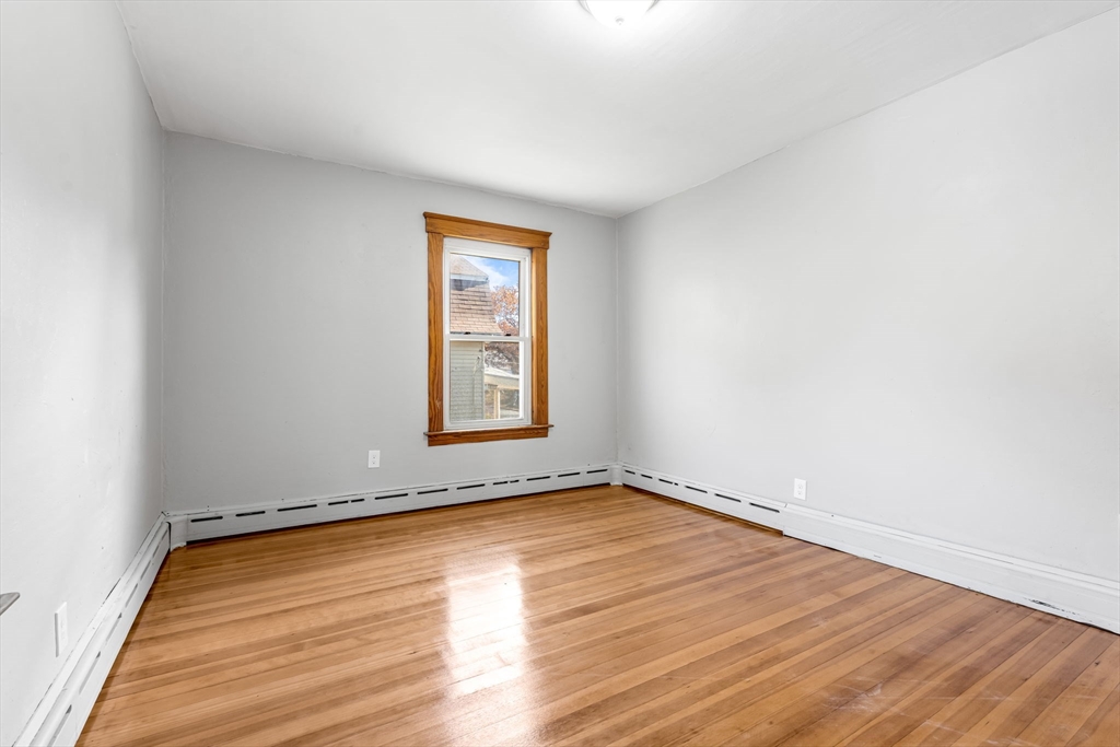 105 Conant Street Gardner, MA 01440 - Photo 15 of 19 an empty room with wooden floor and windows