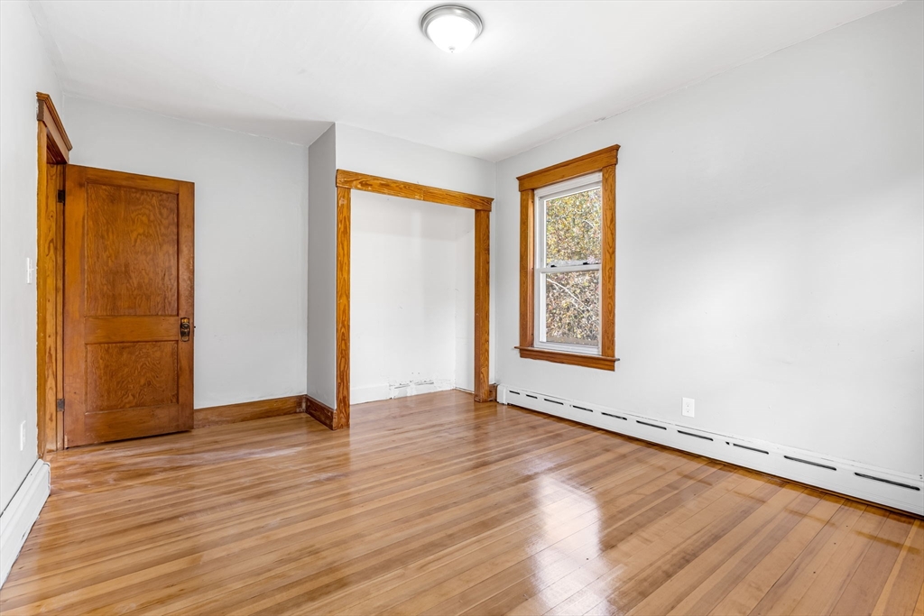 105 Conant Street Gardner, MA 01440 - Photo 17 of 19 an empty room with wooden floor and windows