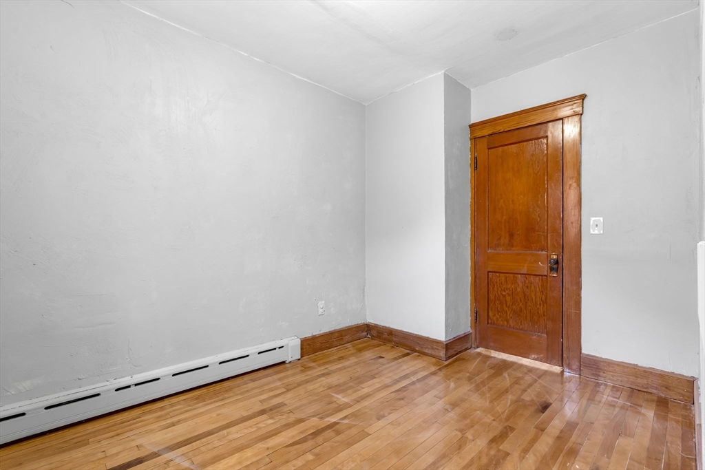 105 Conant Street Gardner, MA 01440 - Photo 6 of 19 an empty room with wooden floor and closet