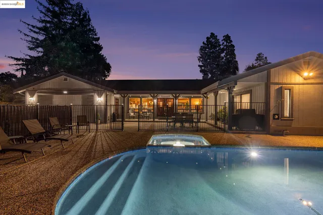 a view of a patio with swimming pool table and chairs