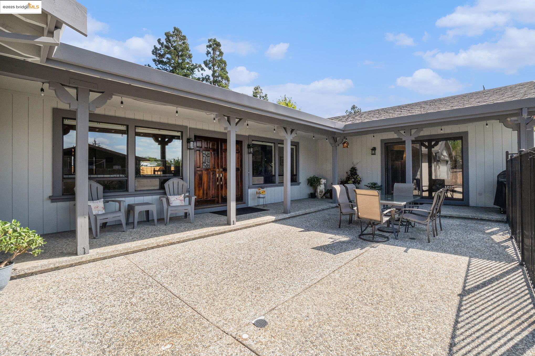 3622 Delancey Lane Concord, CA 94519 - Photo 11 of 32 a building outdoor space with patio furniture and potted plants