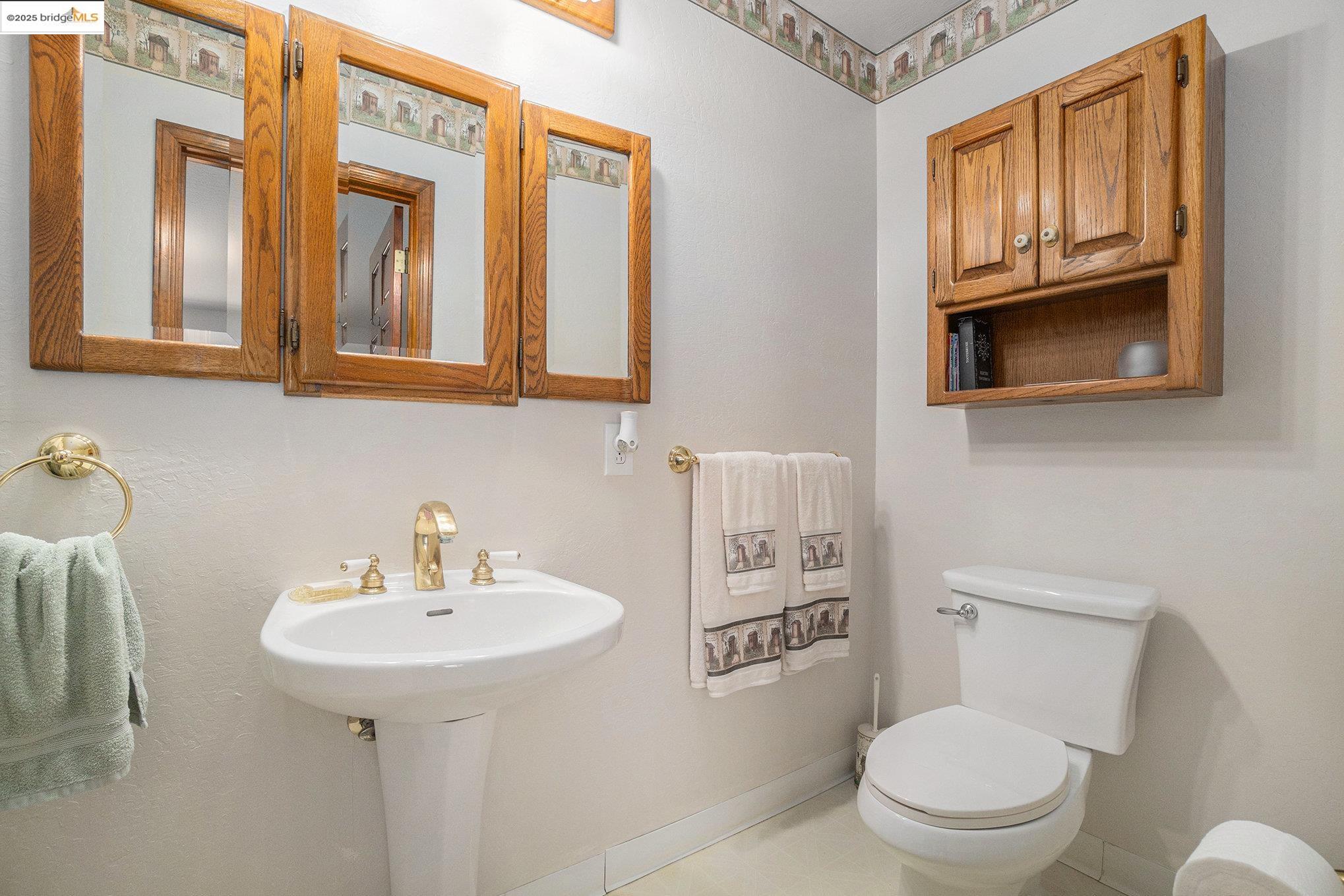 3622 Delancey Lane Concord, CA 94519 - Photo 19 of 32 a bathroom with a toilet sink and mirror