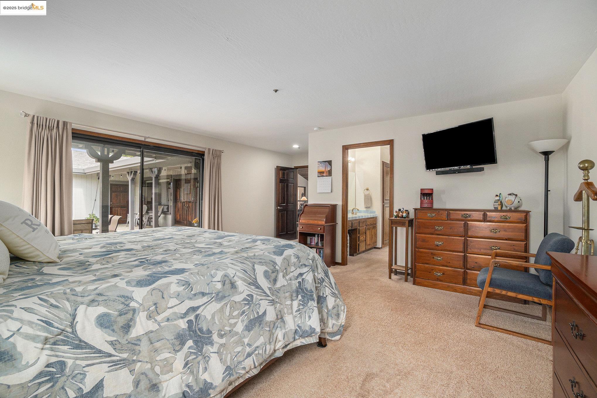 3622 Delancey Lane Concord, CA 94519 - Photo 21 of 32 a bedroom with a bed and flat screen tv