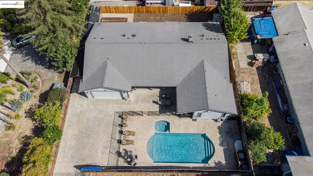 an aerial view of a house with yard