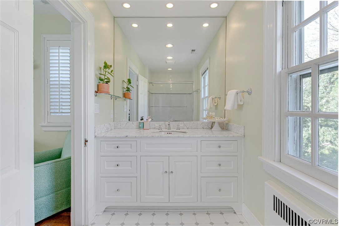 4 South Wilton Road Richmond, VA 23226 - Photo 28 of 49 a bathroom with a sink a vanity and a large mirror