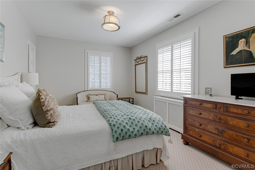 4 South Wilton Road Richmond, VA 23226 - Photo 29 of 49 a bedroom with a bed and a flat screen tv