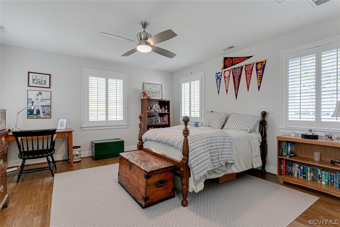 4 South Wilton Road Richmond, VA 23226 - Photo 31 of 49 a spacious bedroom with a bed a dresser and a window