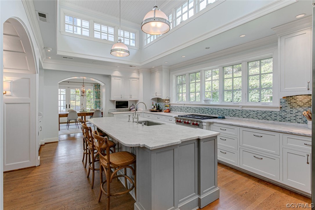4 South Wilton Road Richmond, VA 23226 - Photo 9 of 49 a kitchen with a table chairs and white cabinets