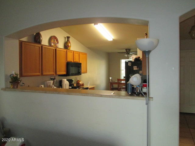 8531 West Payson Road Tolleson, AZ 85353 - Photo 4 of 17 great room into kitchen