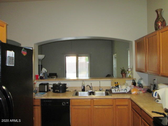 8531 West Payson Road Tolleson, AZ 85353 - Photo 6 of 17 kitchen into great room