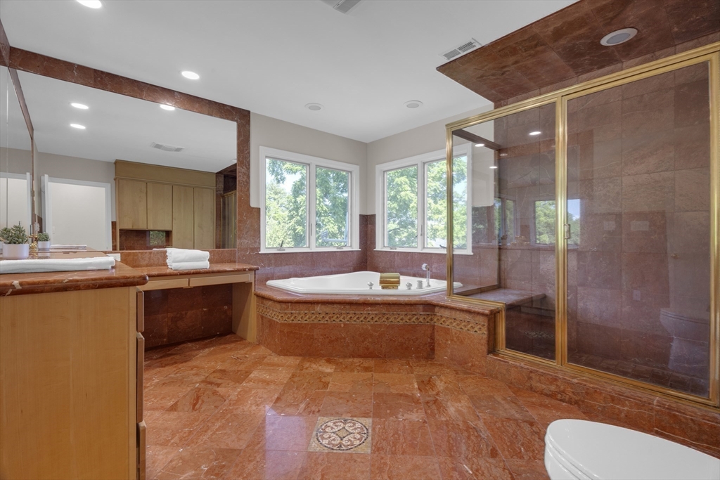 15 Marcellus Drive Newton, MA 02459 - Photo 16 of 27 a large bathroom with a large tub and sink