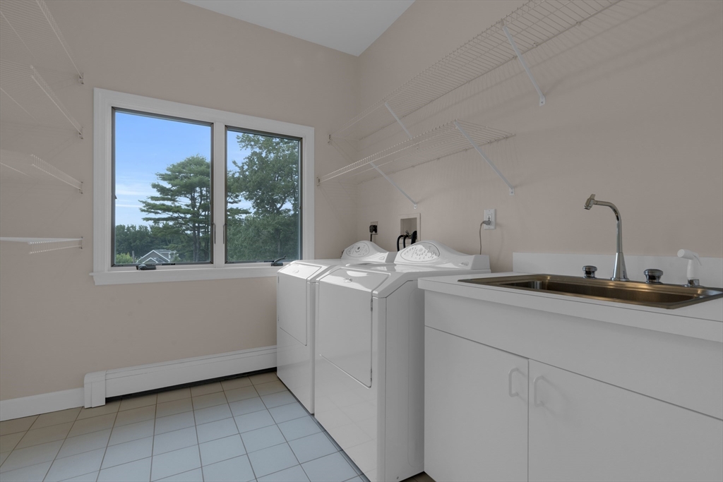 15 Marcellus Drive Newton, MA 02459 - Photo 17 of 27 a utility room with sink dryer and washer
