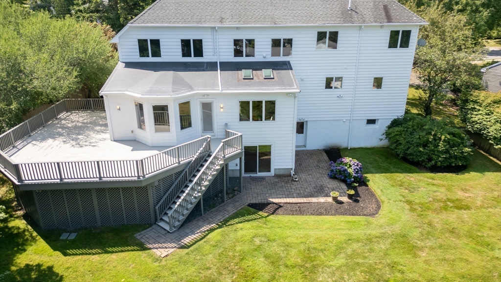 15 Marcellus Drive Newton, MA 02459 - Photo 22 of 27 a view of a house with pool and chairs
