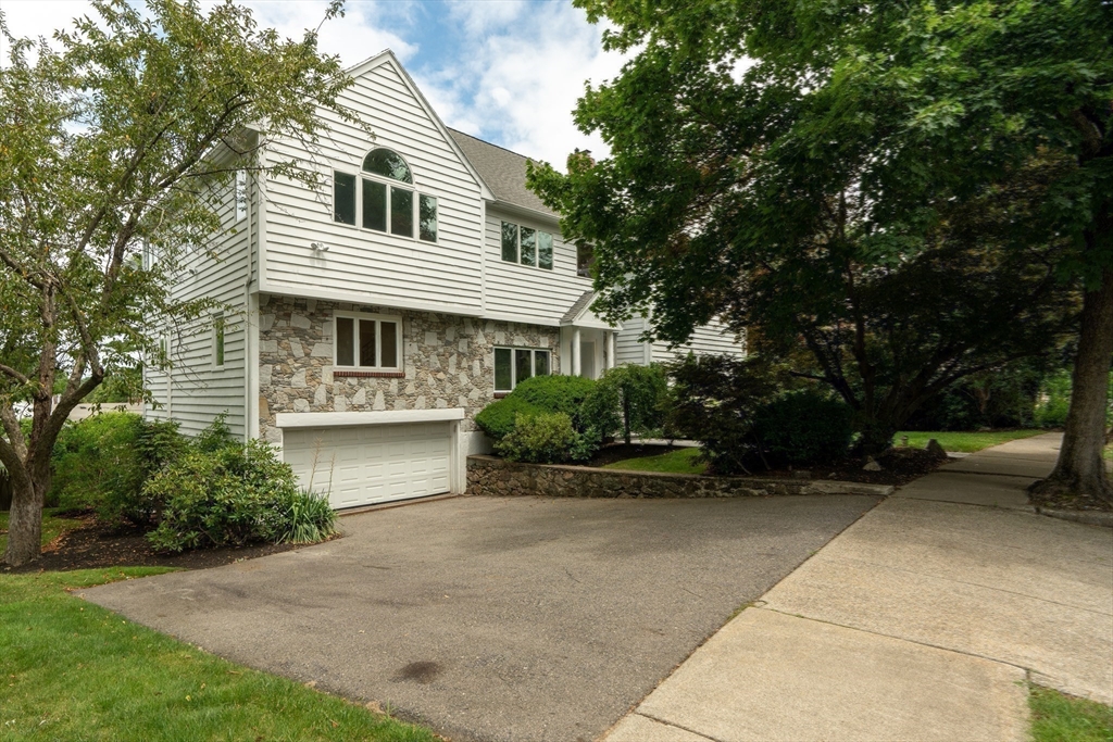 15 Marcellus Drive Newton, MA 02459 - Photo 25 of 27 a front view of a house with garden