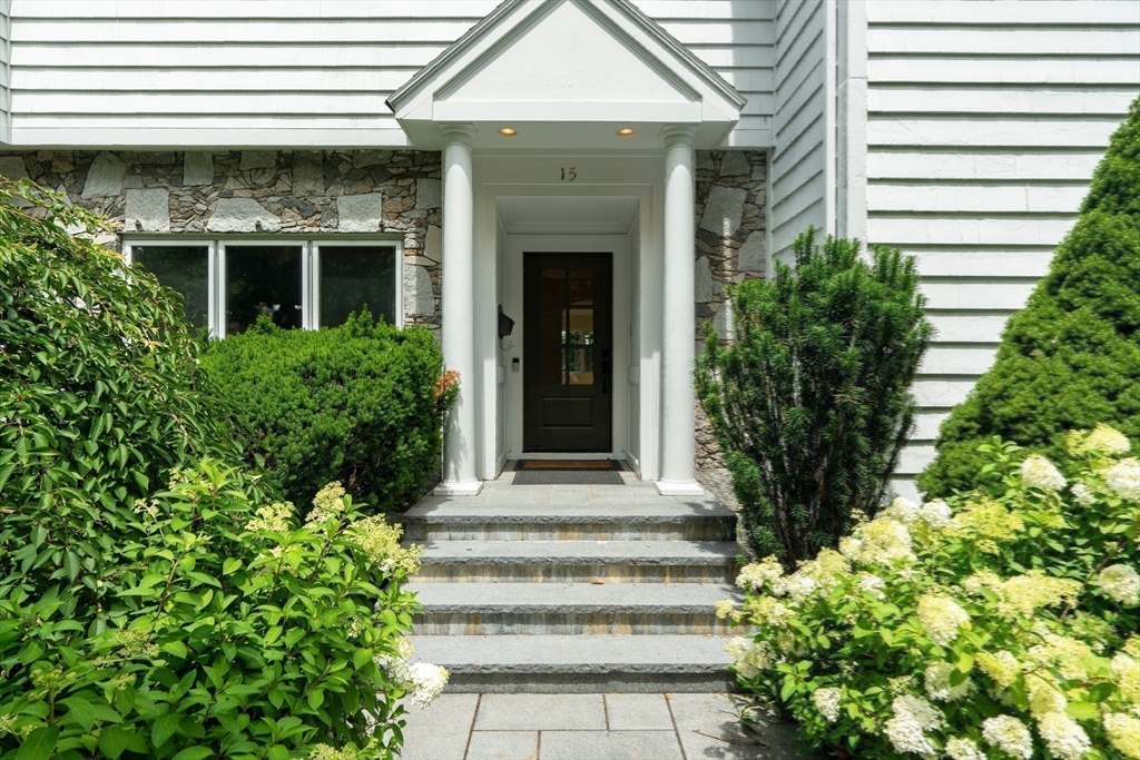 15 Marcellus Drive Newton, MA 02459 - Photo 27 of 27 a front view of a house with a garden