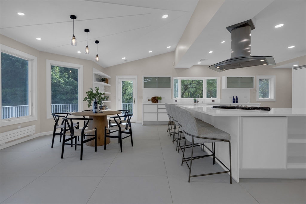 15 Marcellus Drive Newton, MA 02459 - Photo 4 of 27 a kitchen with a table and chairs in it