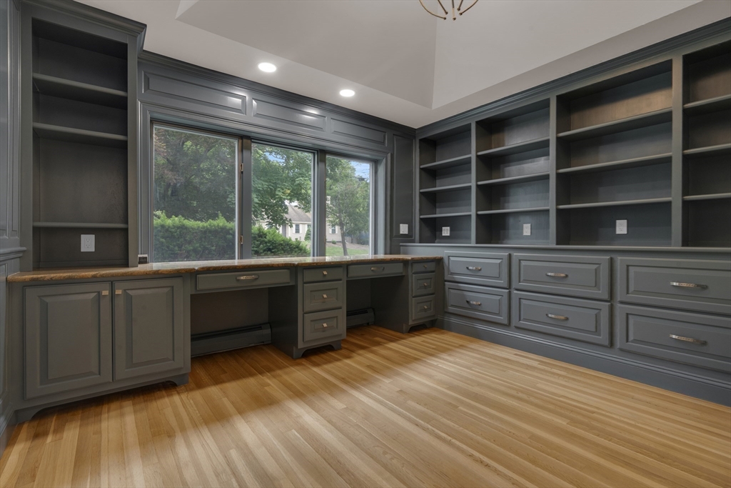 15 Marcellus Drive Newton, MA 02459 - Photo 10 of 27 a kitchen with stainless steel appliances granite countertop a stove a sink and a large window