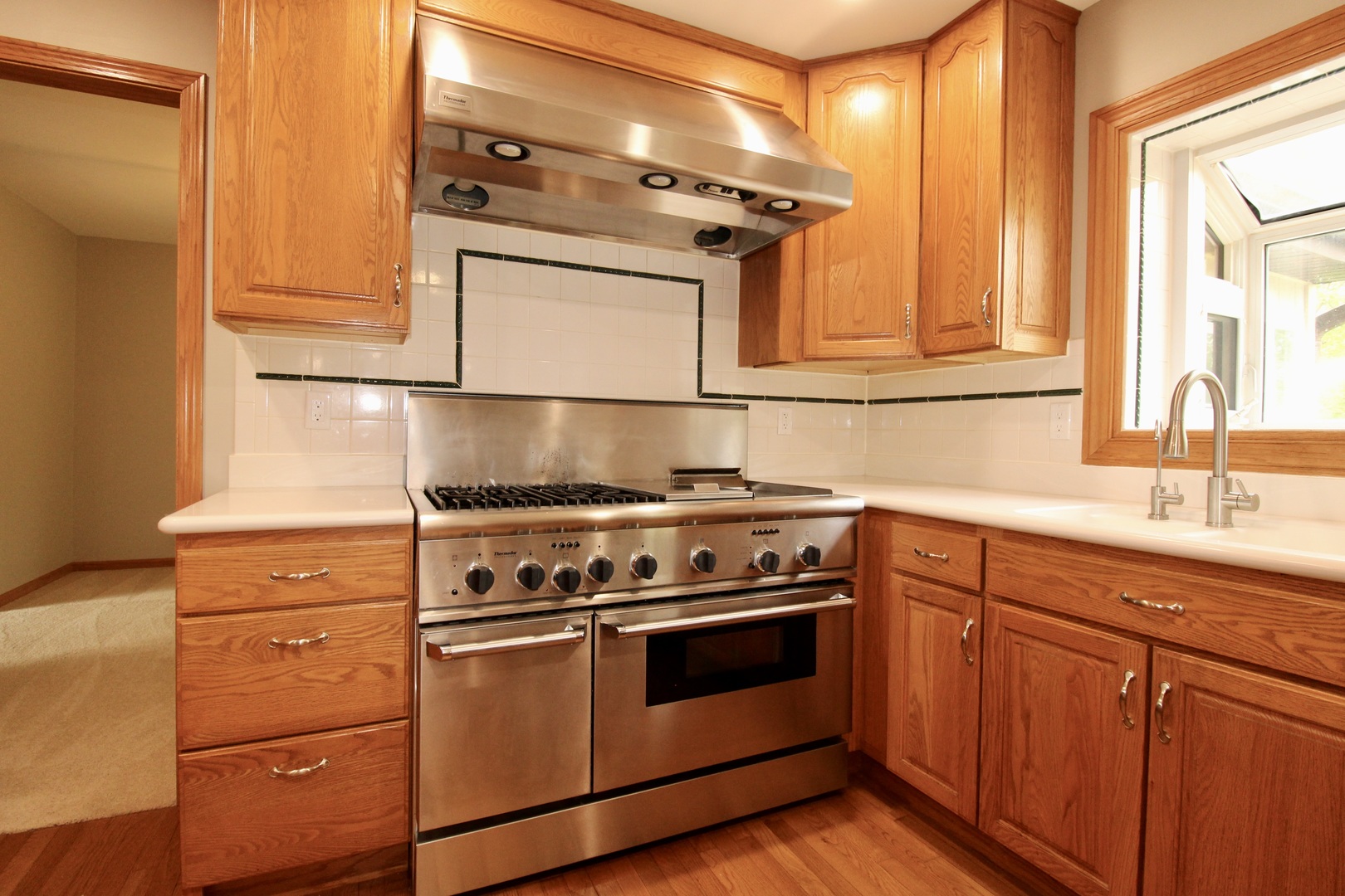 1505 Pheasant Run Road Harvard, IL 60033 - Photo 19 of 30 a kitchen with a stove and a sink