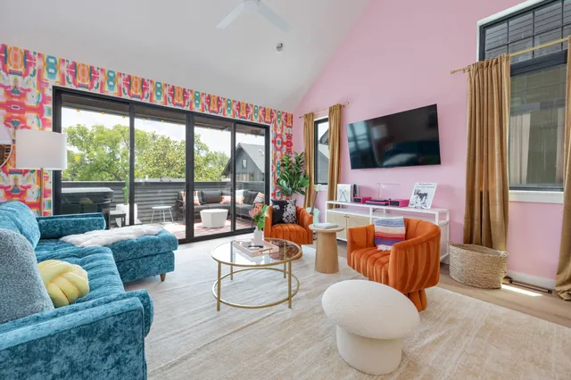 a living room with furniture and a flat screen tv