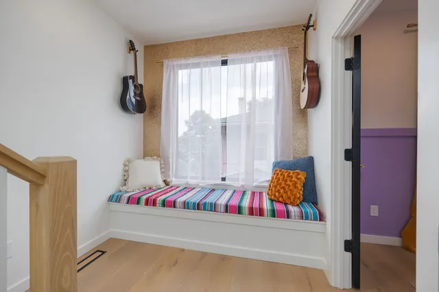 a kitchen with stainless steel appliances granite countertop a refrigerator oven a sink dishwasher and white cabinets with wooden floor