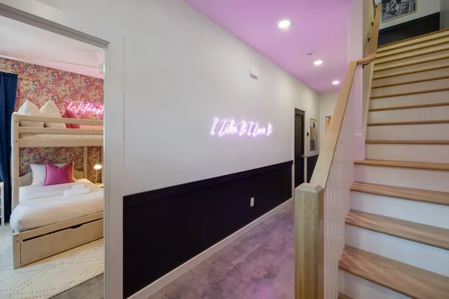 a bedroom with a bed and a couch