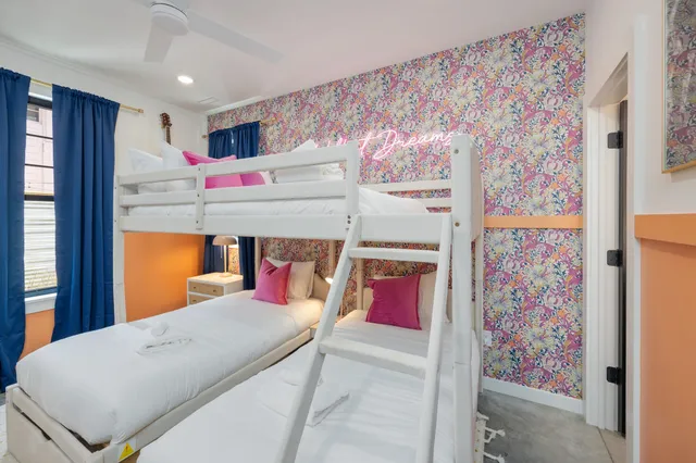 a bedroom with a bed and a table in it