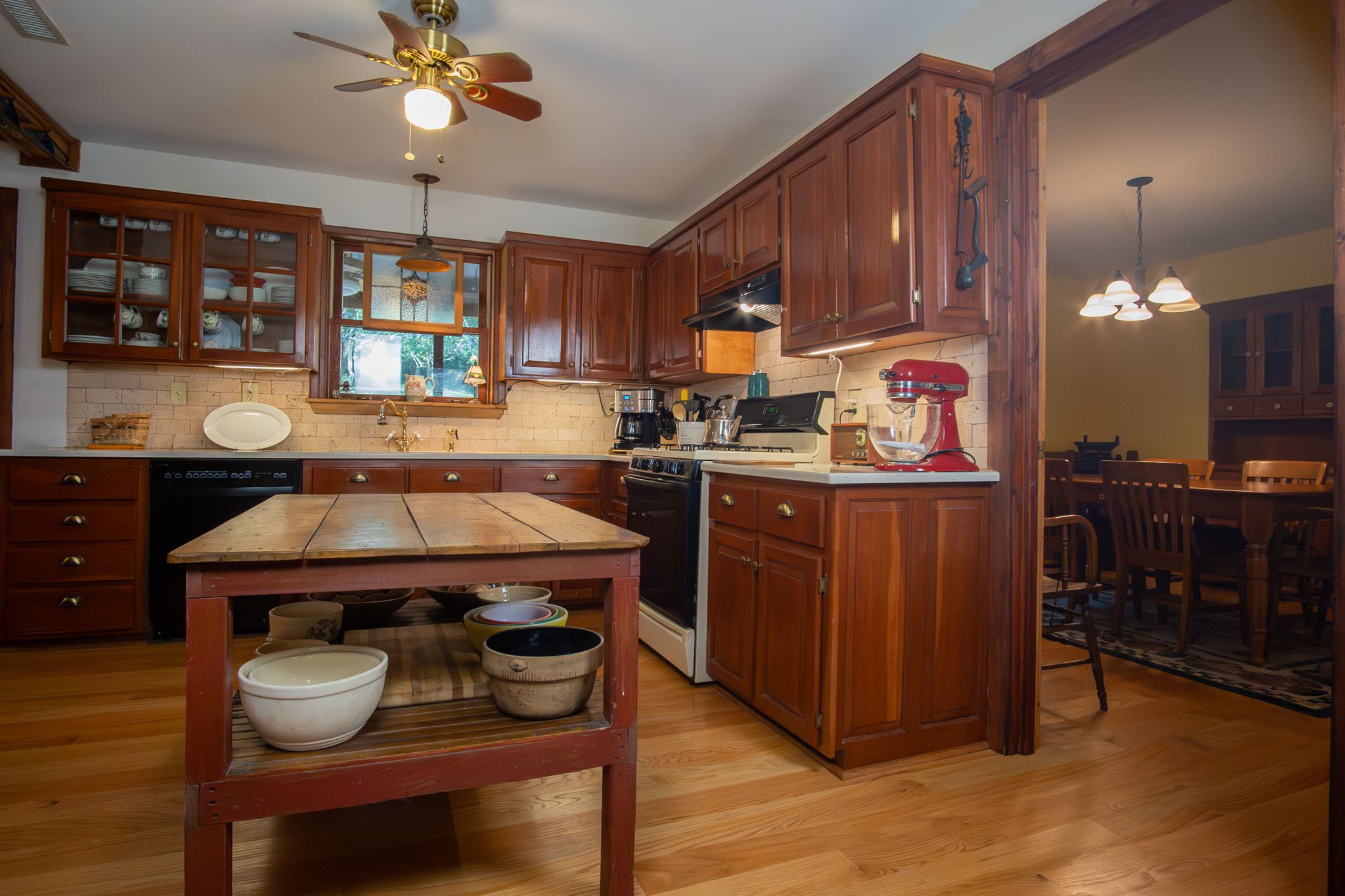 6861 Arno-Allisona Road College Grove, TN 37046 - Photo 18 of 68 a kitchen with a stove a cabinets and chairs