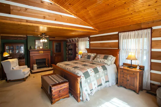 a bedroom with furniture and window